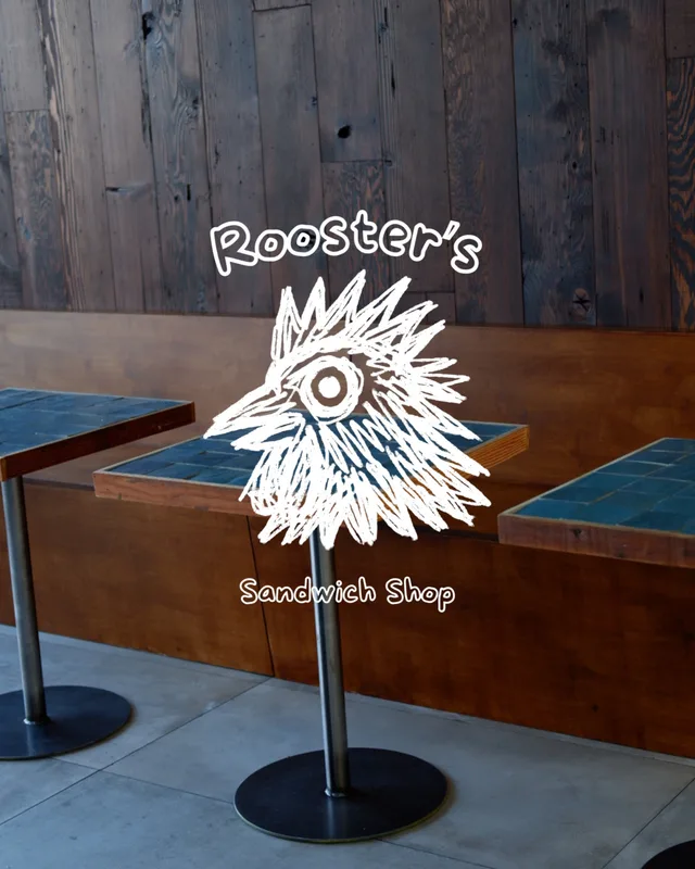 Rooster's Sandwich Shop artwork over the shop's blue tiled tables and wood walls